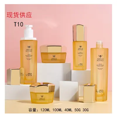 Bộ chai + hũ thủy tinh vàng cam nắp vàng lục giác T10 – mã NXG0475