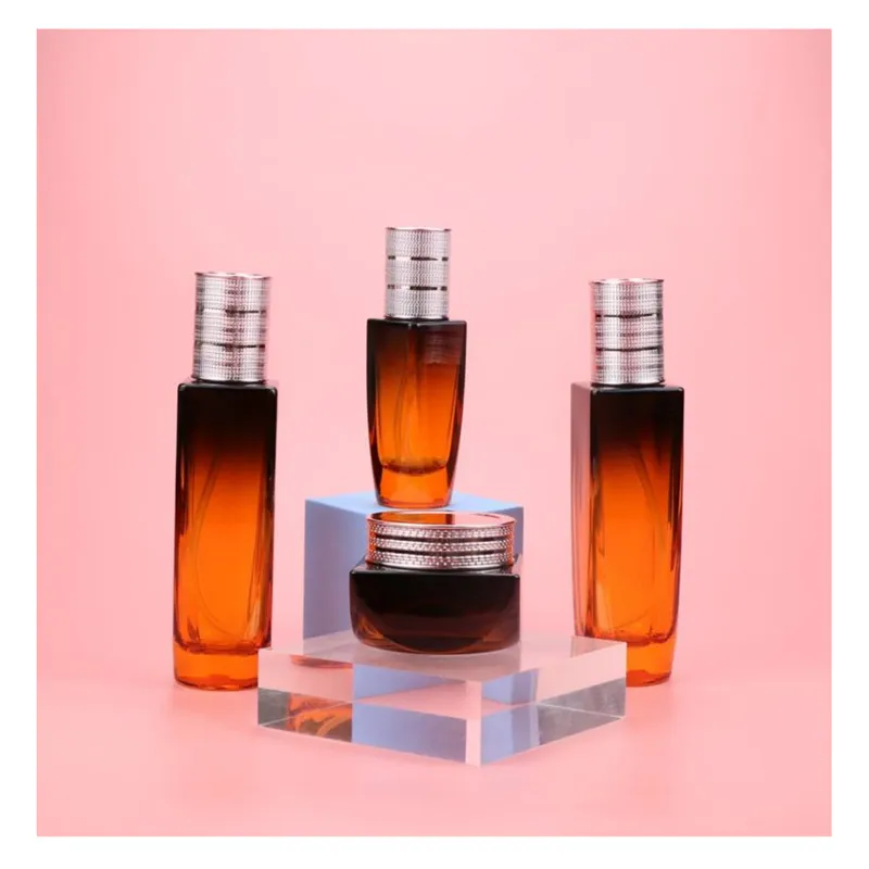Bộ chai + hũ thủy tinh cam nâu chuyển màu nắp bạc – mã NXG0575